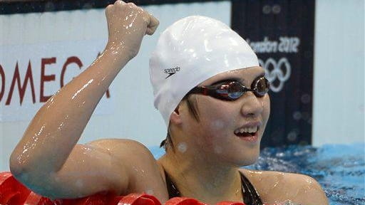 China's Ye Shiwen celebrates after winning the women's 400-meter individual...