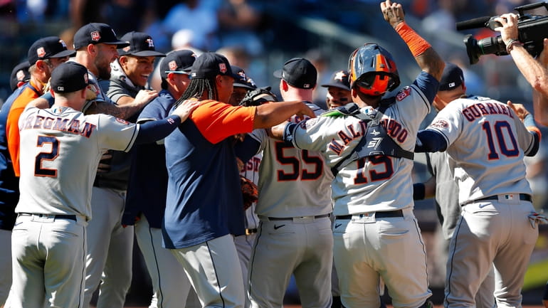 The Houston Astros celebrate after a combined no-hitter against the...