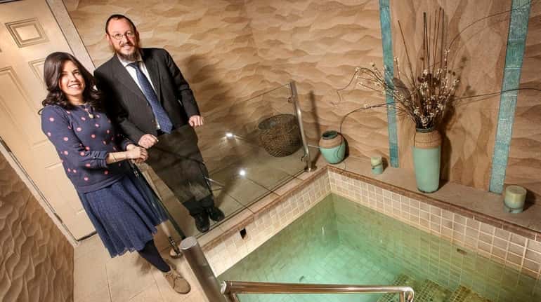 Rabbi Berel Sasonkin and his wife, Chaya, near the ritual...