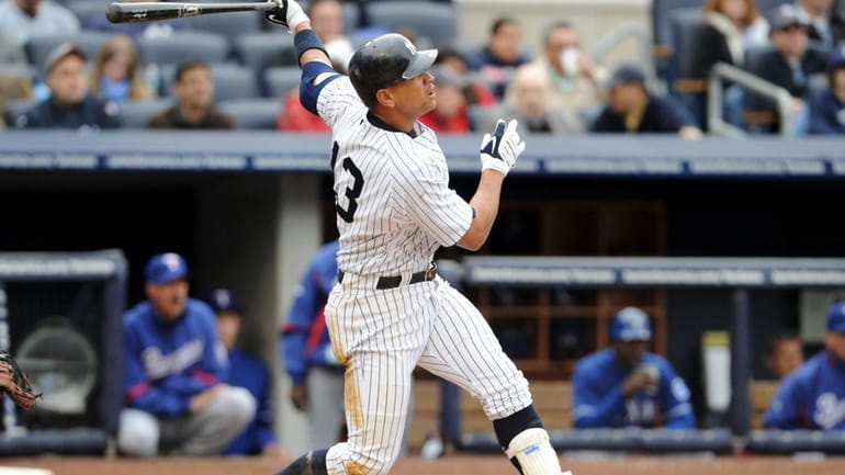 New York Yankees third baseman Alex Rodriguez (13) hits a...