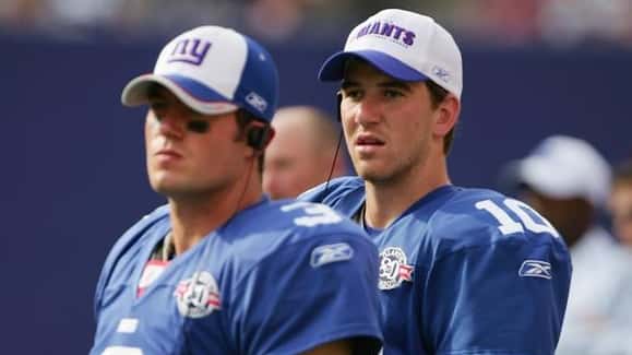 Eli Manning #10 and Jesse Palmer #3 of the New...
