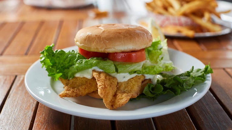 The flounder sandwich with lettuce, tomato, homemade tarter sauce and coleslaw...