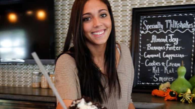 Kristen Picciano of Kings Park serves a Cookies and Cream...