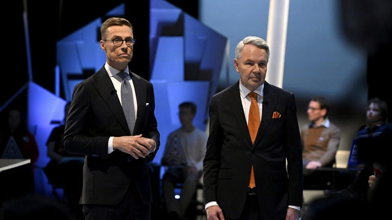 National Coalition Party (NCP) presidential candidate Alexander Stubb, left, and...