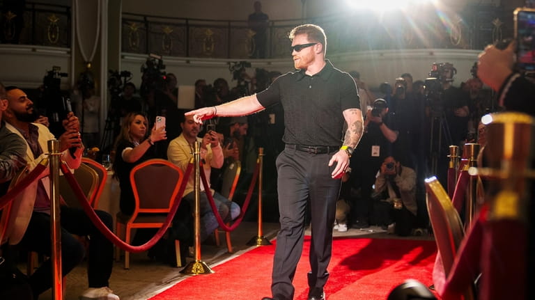 Undisputed super middleweight champion Canelo Alvarez arrives at a news...