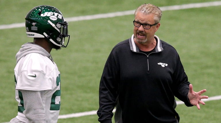 Jets safety Marcus Maye talks to defensive coordinator Gregg Williams...