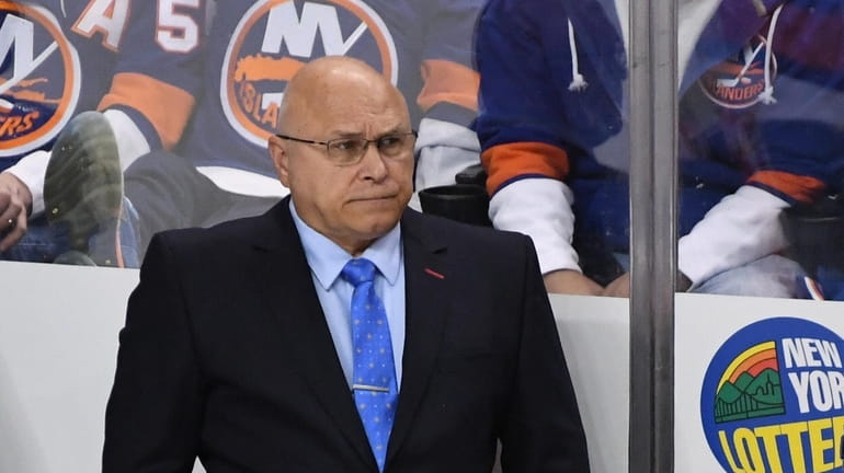 Islanders head coach Barry Trotz looks on against the Vancouver...