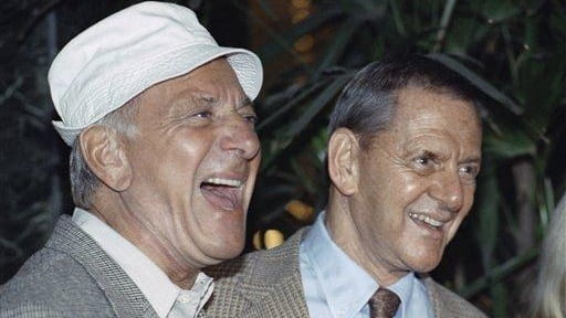Jack Klugman, left, and Tony Randall laugh at a news...
