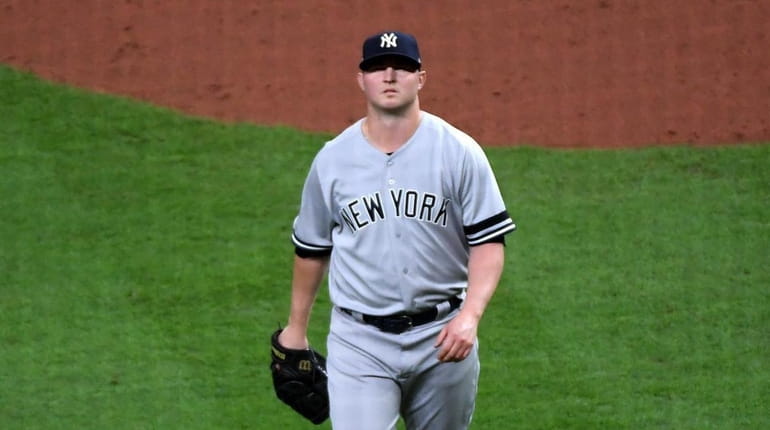 Yankees relief pitcher Zack Britton (53) walks off the mound...