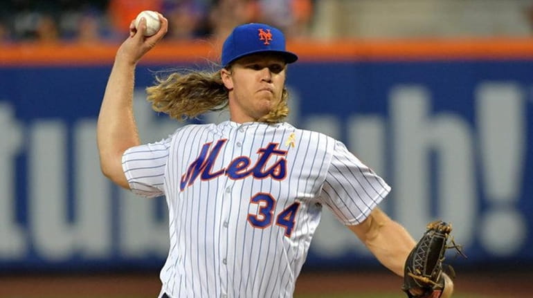 Noah Syndergaard pitches for the Mets against the Washington Nationals...