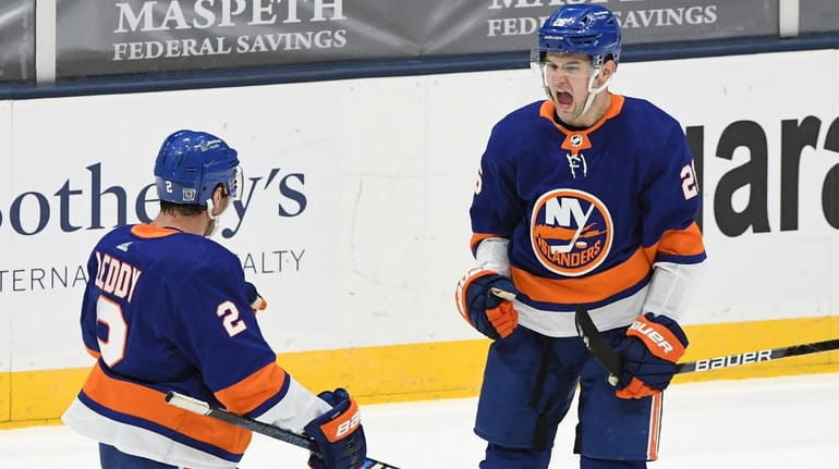 New York Islanders right wing Oliver Wahlstrom reacts with defenseman...