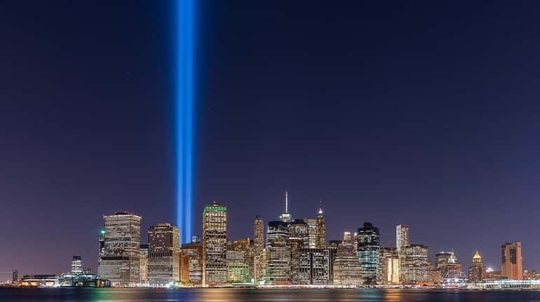 Two blue pillars of light beam where the Twin Towers...