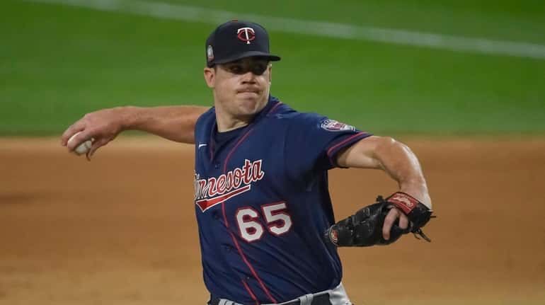 Trevor May of the Minnesota Twins pitches in the ninth inning...