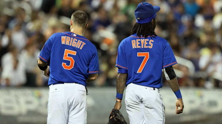 David Wright and Jose Reyes look on after an inning...