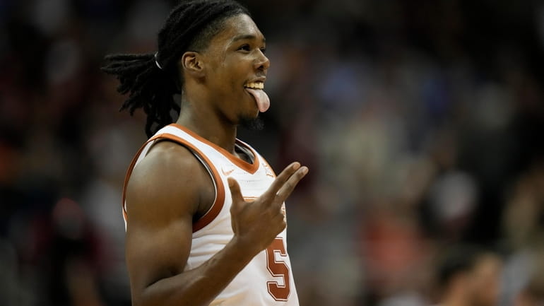 Texas guard Marcus Carr celebrates after scoring against Xavier in...