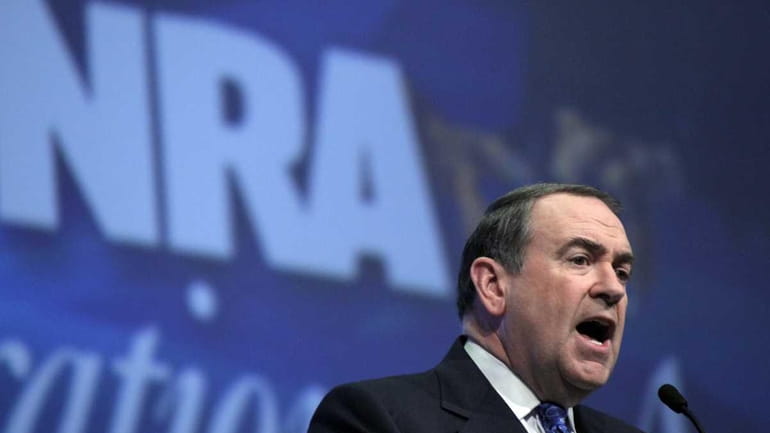 Former governor of Arkansas, Michael Huckabee, addresses the National Rifle...