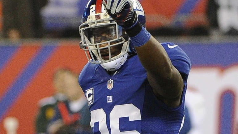 Antrel Rolle reacts in the second half of a game...