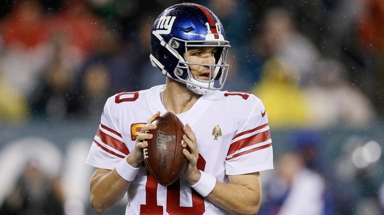 The Giants' Eli Manning plays during the first half against...