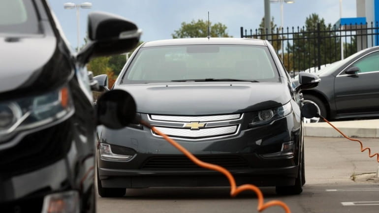 Chevrolet Volt owners charge their Volt electric vehicles at Serra...