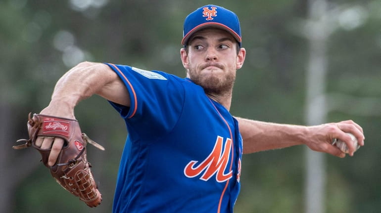 Mets pitcher Steven Matz throws during a spring training workout...