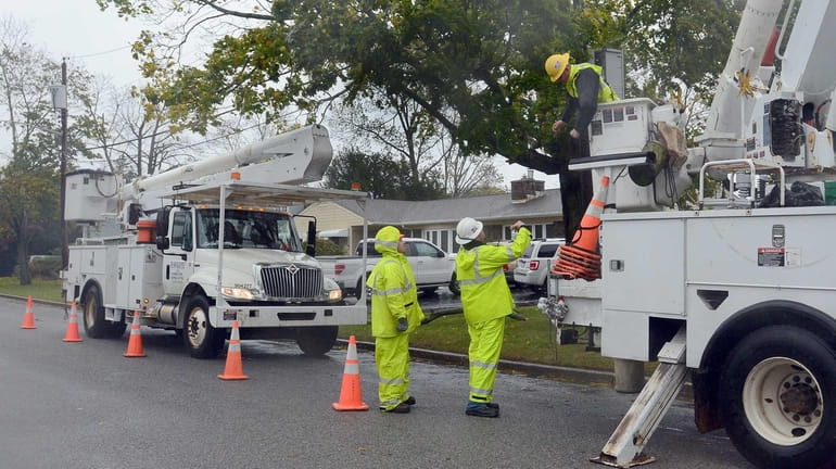 LIPA Electrical contractors work to restore power in Patchogue during...