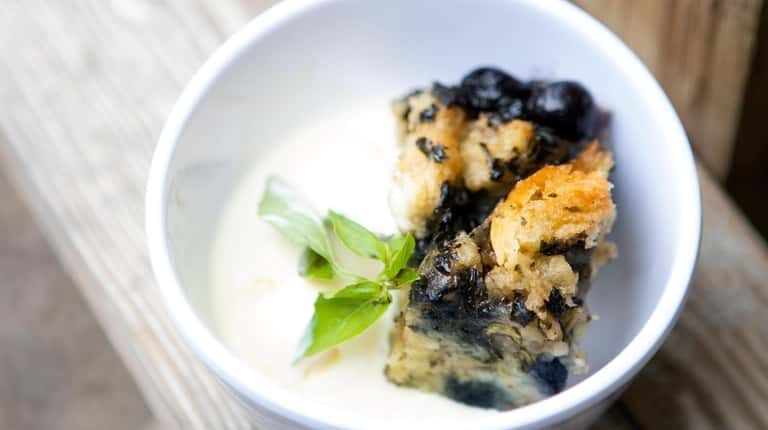 Blueberry basil bread pudding is served with homemade coconut ice...