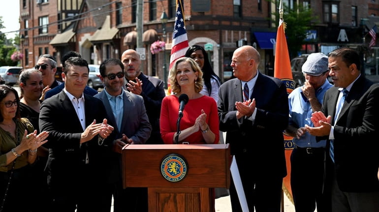 Nassau County Executive Laura Curran and other community leaders in downtown...