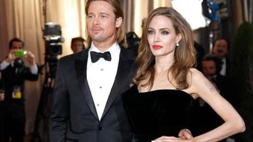 Angelina Jolie and actor Brad Pitt arrive at the 84th...