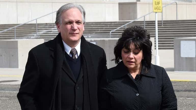 Edward and Linda Mangano outside federal court in Central Islip...