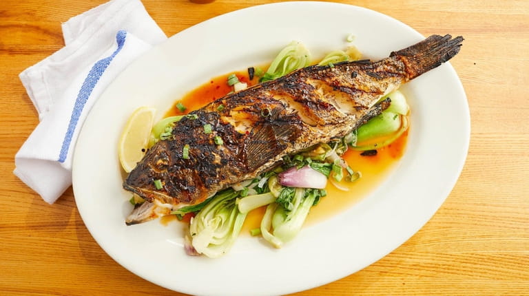 Whole grilled sea bass at Inlet Seafood in Montauk.