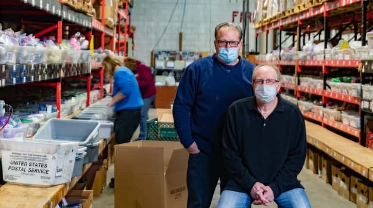 Ron Kaiser and Larry Hirschheimer in the stock room in...
