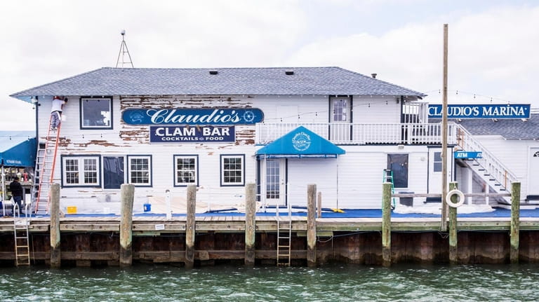 Claudio's Clam Bar, on the  Greenport waterfront, is part of a...