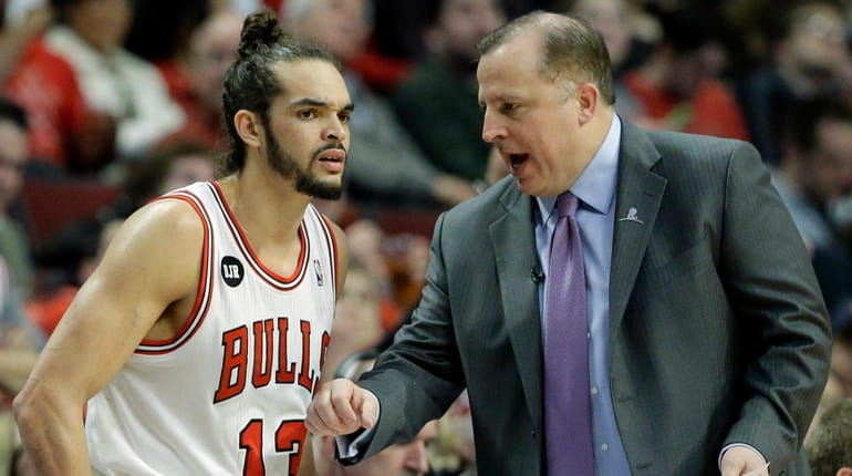 Chicago Bulls center Joakim Noah listens to head coach Tom...