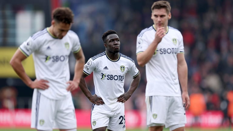 Leeds United's Wilfried Gnonto, center, looks dejected following their defeat...