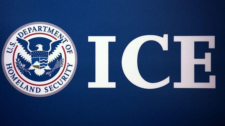 The Immigration and Customs Enforcement (ICE) logo is seen on...