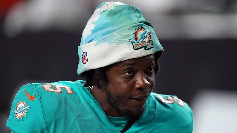 Teddy Bridgewater of the Dolphins walks off the field after...