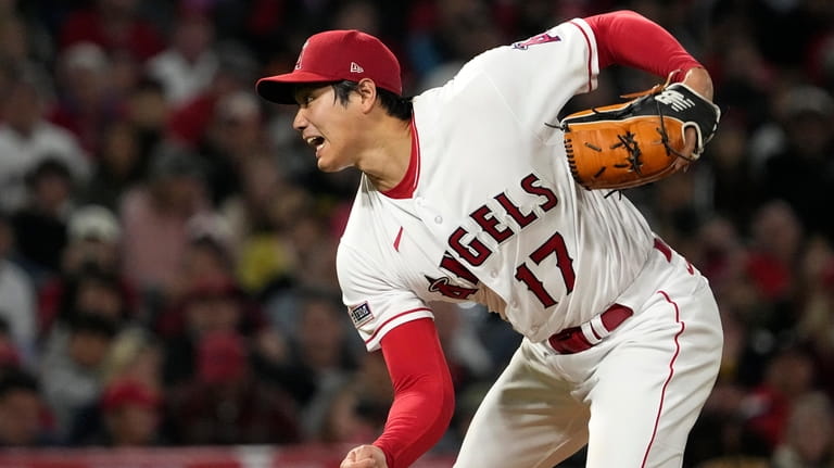 Los Angeles Angels starting pitcher Shohei Ohtani throws to the...