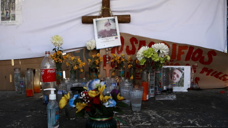 A makeshift altar in honor of migrants who died in...