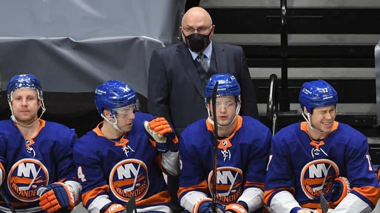 Islanders head coach Barry Trotz looks on in the first...