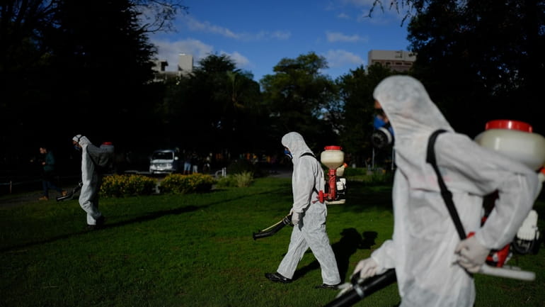 A brigade fumigates to combat dengue amid a surge in...