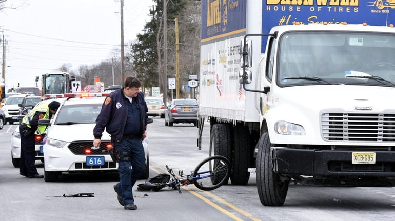 Suffolk police investigate after a bicyclist and a box truck...