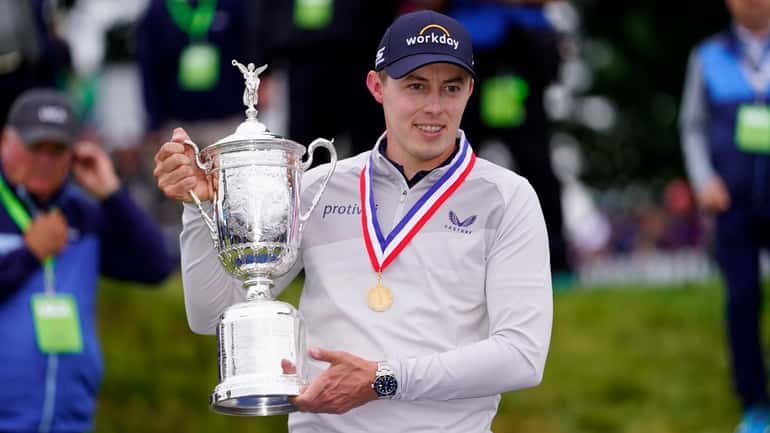 Matthew Fitzpatrick poses with the trophy after winning the U.S. Open at...