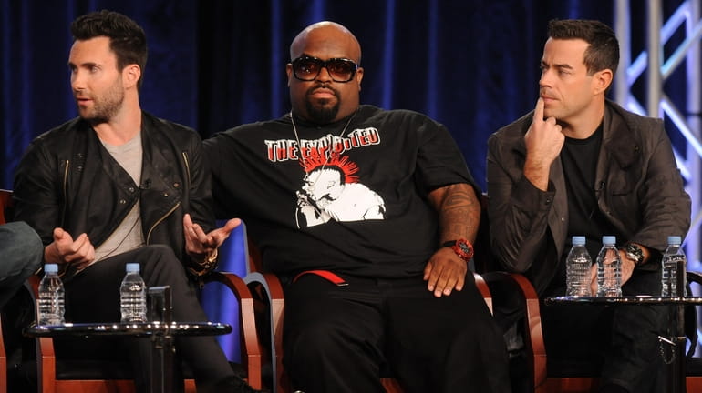 Coaches Adam Levine, left, and Cee Lo Green and host/producer...