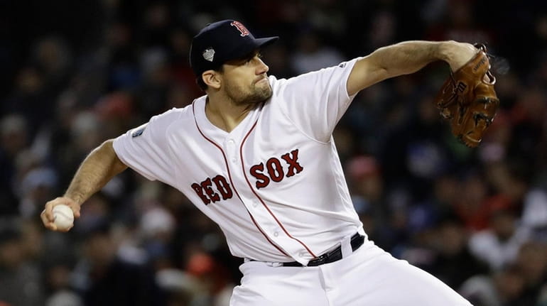 Red Sox pitcher Nathan Eovaldi delivers during the eighth inning...