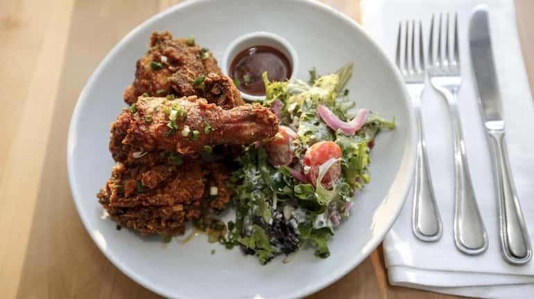 Buttermilk fried chicken, finished with spiced honey, greens with bleu...