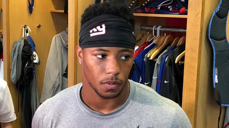 Giants running back Saquon Barkley talks to reporters in East Rutherford,...