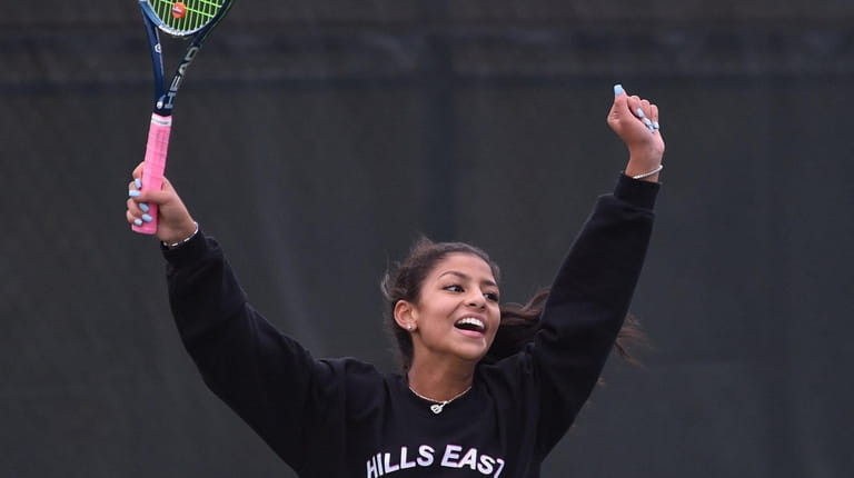Angelina Malik of Half Hollow Hills East reacts after her...