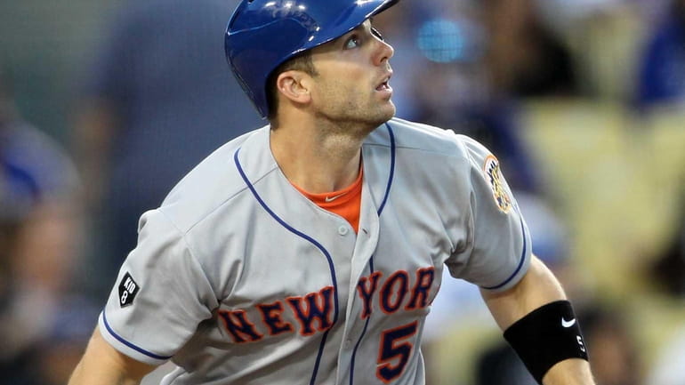 David Wright watches his solo home run against the Los...