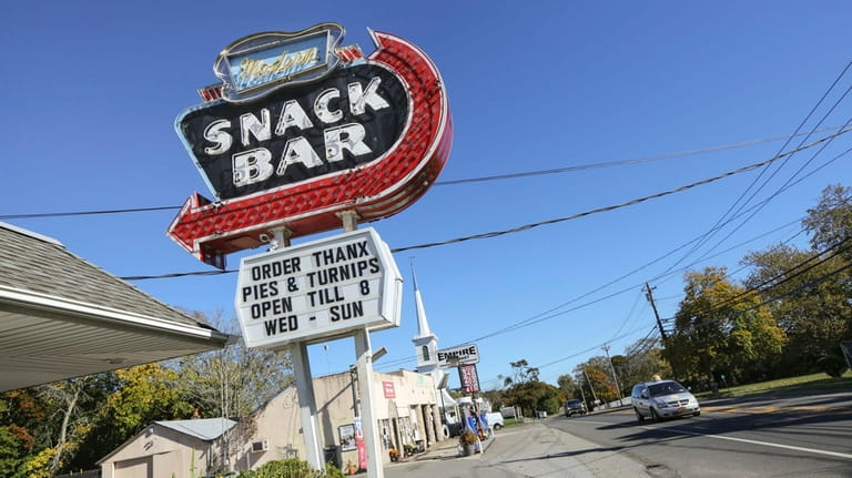 The Modern Snack Bar, with lts iconic neon sign, is...