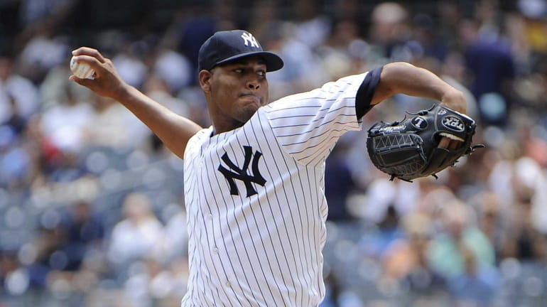 Yankees starting pitcher Ivan Nova delivers against the Tampa Bay...